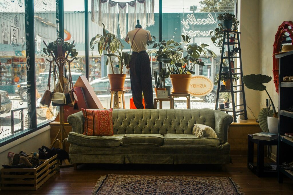 a living room filled with furniture and lots of windows